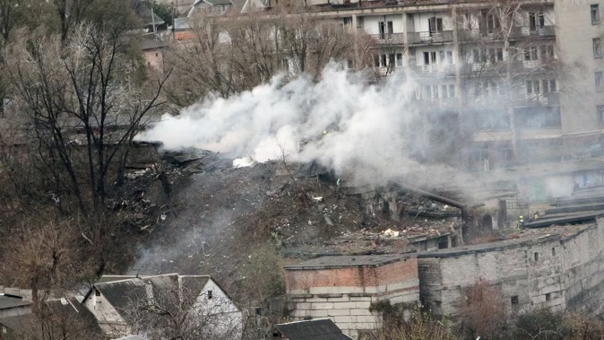 A pillar of smoke rises over a garage co-operative damaged by a Russian missile strike in Dnipro, Ukraine on November 21, 2024. Photo / Getty Images