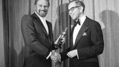 Walter Mirisch, right, and Charlton Heston celebrate at the 34th annual Golden Globe awards, presented by the Hollywood Foreign Press Association at the Beverly Hilton in Los Angeles, on Jan. 29, 1977.  Photo / AP