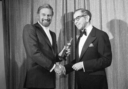 Walter Mirisch, right, and Charlton Heston celebrate at the 34th annual Golden Globe awards, presented by the Hollywood Foreign Press Association at the Beverly Hilton in Los Angeles, on Jan. 29, 1977.  Photo / AP