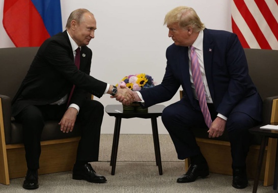 Donald Trump greets Russian President Vladimir Putin during their bilateral meeting at the G20 Osaka Summit 2019. (Photo / Getty Images)