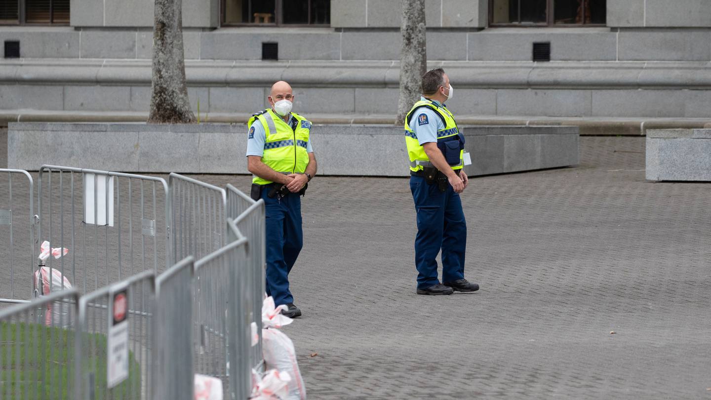 Police officers patrol Parliament grounds ahead of more planned protests in Wellington. (Photo / Mark Mitchell)