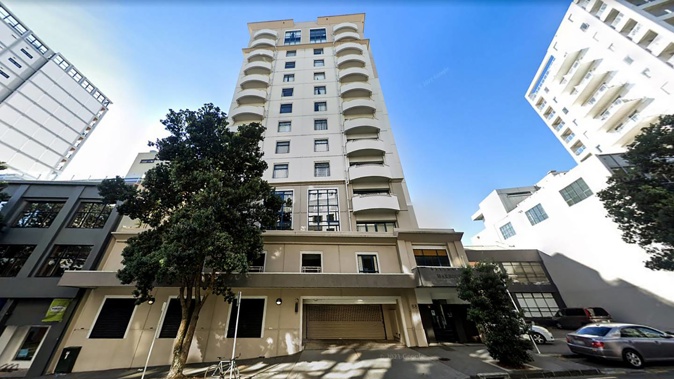 The Central Auckland apartment building was being serviced by window cleaners when she cut their abseiling ropes. Photo / Google Maps