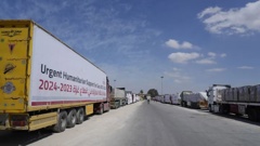 Egyptian humanitarian aids trucks line up to cross the Rafah border crossing between Egypt and the Gaza Strip. Photo / AP