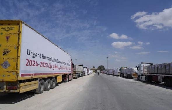 Egyptian humanitarian aids trucks line up to cross the Rafah border crossing between Egypt and the Gaza Strip. Photo / AP