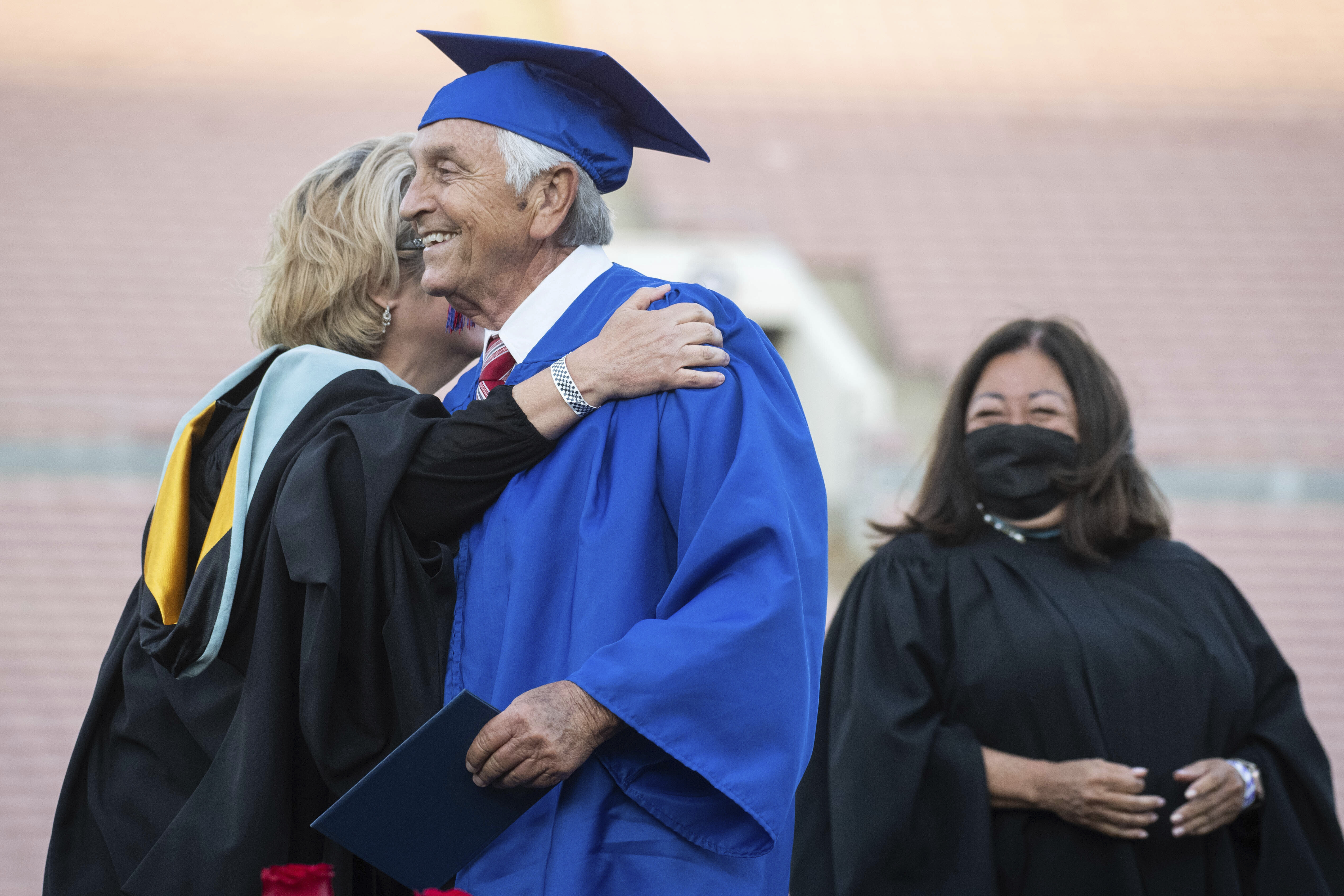Ted Sams, 78, receives his original high school diploma during San Gabriel High School's graduation. Photo / AP