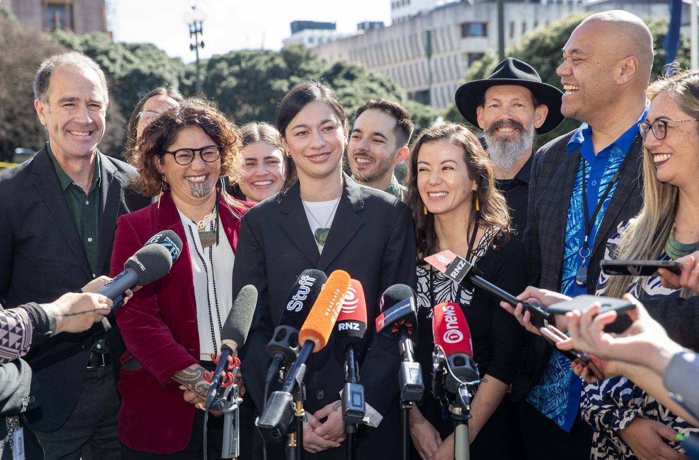 New Green Party MPs (front, from left): Scott Willis, Darleen Tana, Tamatha Paul, Lan Pham, Efeso Collins and Hūhana Lyndon with Steve Abel (rear, third from right). Photo / Mark Mitchell