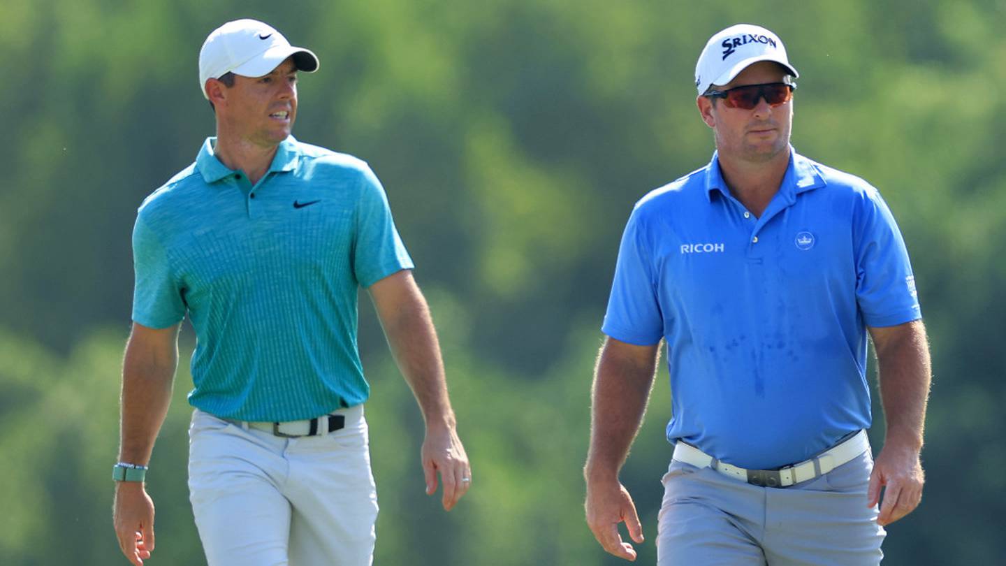 Rory McIlroy (L) and Ryan Fox walk a fairway together for the first time. Photo / Getty