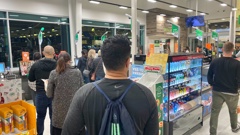Queues of people were having trouble at the checkout in Woolworths Hobsonville due to the eftpos issues. Photo / Dean Purcell