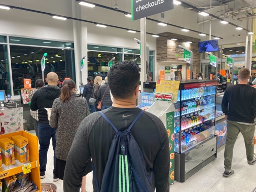 Queues of people were having trouble at the checkout in Woolworths Hobsonville due to the eftpos issues. Photo / Dean Purcell