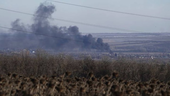 Smoke billows during fighting between Ukrainian and Russian forces in Soledar, Donetsk region, Ukraine, on Wednesday. Photo / AP