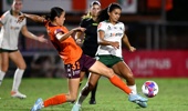 Alicia Woods of the Roar and Emma Pijnenburg of the Phoenix challenge for the ball during leg one of the A-League Women Semi Final series between Brisbane Roar and Wellington Phoenix at Spencer Park, on May 03, 2026, in Brisbane, Australia. (Photo by Bradley Kanaris/Getty Images)