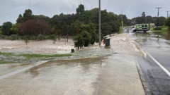 Water spilling over Beach Rd, Waihī Beach from the Maranui Pond on May 29.