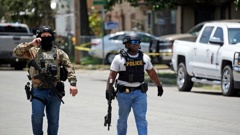 Police walk near Robb Elementary School following a shooting, Tuesday, May 24, 2022, in Uvalde, Texas. Photo / AP