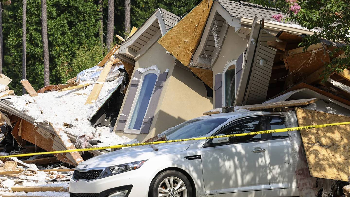 A vehicle is seen under the rubble of a home on Lake Norman that collapsed in Mooresville, North Carolina. Photo / AP
