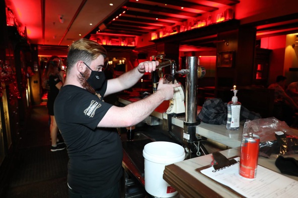 Hospitality businesses - like Irish pub Danny Doolans in the Auckland Viaduct - opened at 11.59pm on Thursday as New Zealand entered the traffic light system. (Photo / Hayden Woodward)