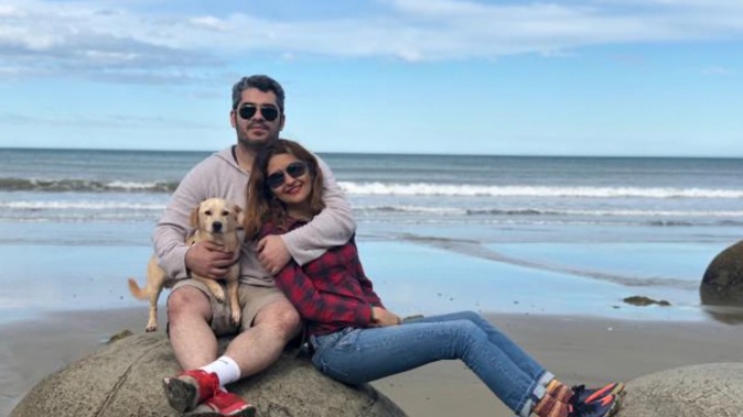 Dunedin couple Reza Fatemi and Sahar Abdolmaleki, pictured during a recent visit to the Moeraki Boulders, have been left out in the cold on gaining New Zealand residency. (Photo / ODT)