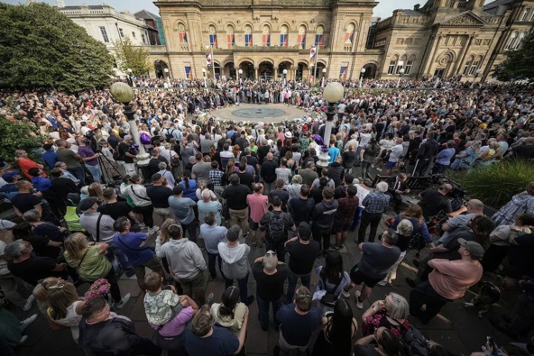 People attend a vigil outside the Atkinson building in central Southport which was held for the child victims of the knife attack. Photo / Getty Images