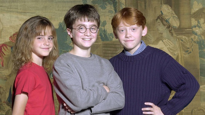 Daniel Radcliffe (centre), was catapulted to stardom when he was chosen for the title role in Harry Potter when he was just 10 years old. Photo / Getty Images
