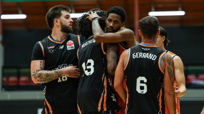 Sejin Mathew (second left) of the Indian Panthers and Keylan Boone (centre) of the Southland Sharks during an NBL clash. Photo / Photosport