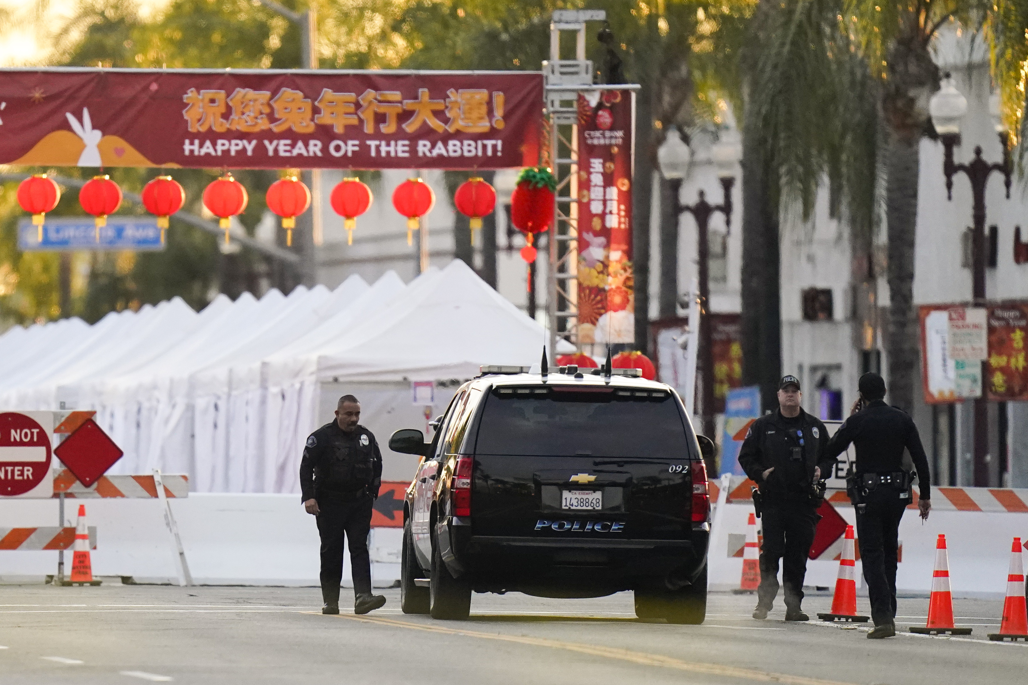 Police officers stand outside a ballroom dance club in Monterey Park, Calif., Sunday, Jan. 22, 2023. A mass shooting took place at a dance club following a Lunar New Year celebration, setting off a manhunt for the suspect. Photo / AP
