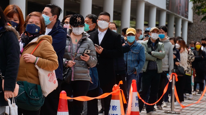 Residents line up to get tested for the coronavirus at a temporary testing center in Hong Kong Wednesday, Feb. 23, 2022. (Photo / AP)