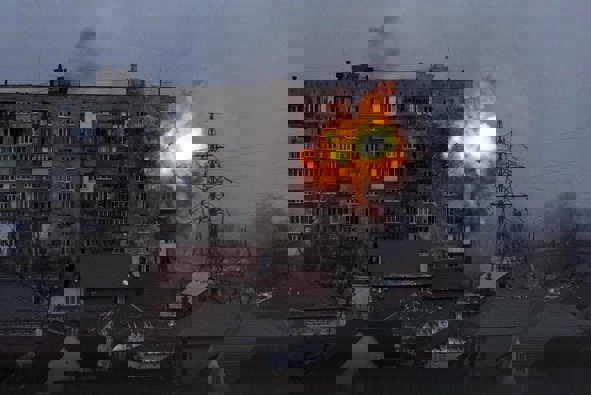 An explosion is seen in an apartment building after Russian's army tank fires in Mariupol, Ukraine. (Photo / AP)