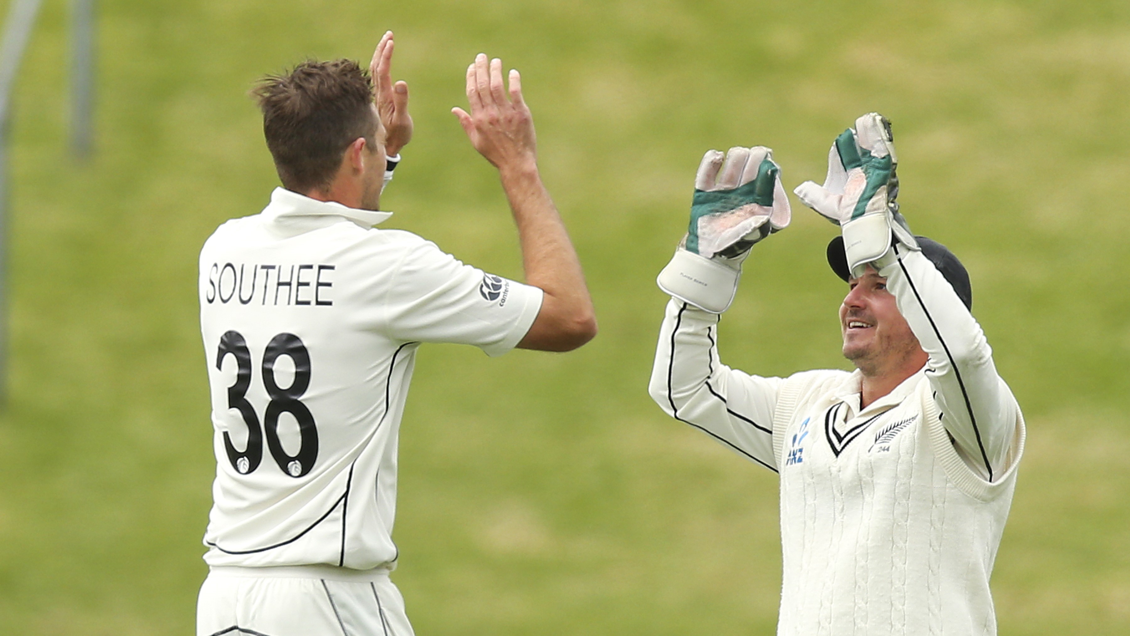 Tim Southee of New Zealand celebrates with BJ Watling after taking the wicket of Alzarri Joseph of West Indies during day four of the second test match in the series between New Zealand and the West Indies at Basin Reserve on December 14, 2020 in Wellington, New Zealand. (Photo by Hagen Hopkins/Getty Images)