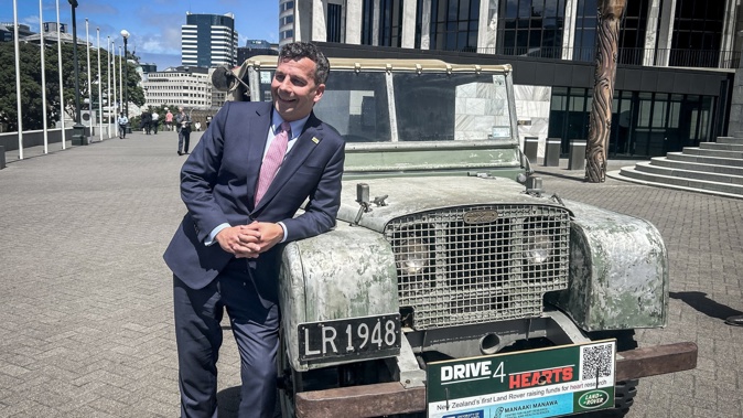 Act party leader David Seymour with the old Land Rover vehicle that he attempted to drive up the steps of Parliament before being stopped by security. Photo / Adam Pearce