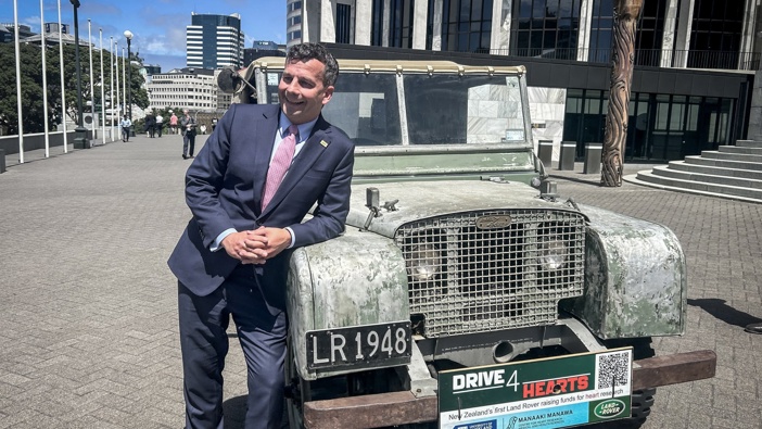 Act party leader David Seymour with the old Land Rover vehicle that he attempted to drive up the steps of Parliament before being stopped by security. Photo / Adam Pearce