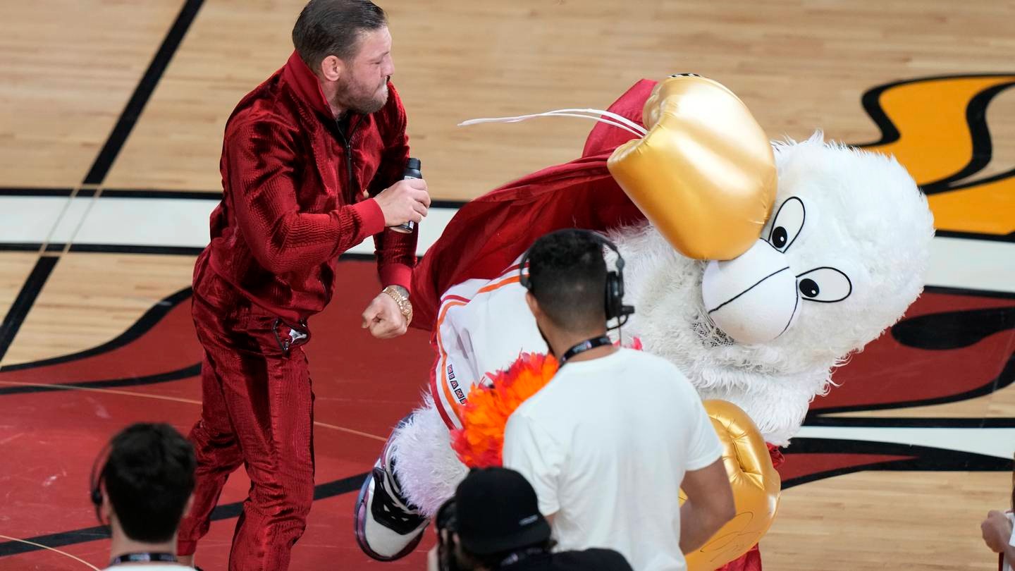 Former MMA fighter Conor McGregor punches Burnie, the Miami Heat mascot, during a break in Game 4 of the basketball NBA Finals against the Denver Nuggets. Photo / AP