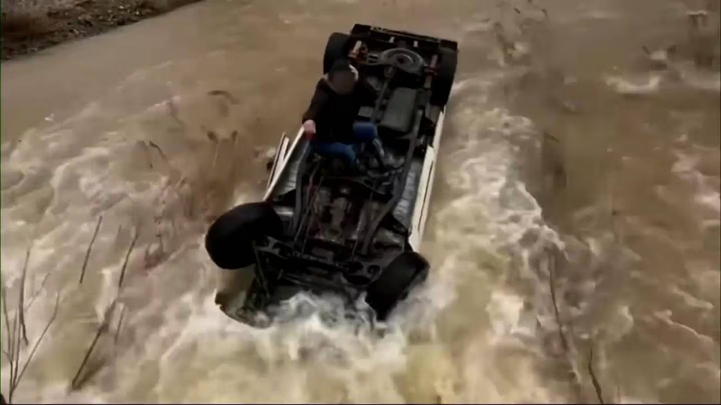 A helicopter team rescued a woman Tuesday morning who was trapped for almost 15 hours atop her overturned pick-up truck. Photo / AP