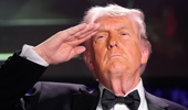 US President Donald Trump salutes during the White House Correspondents' Association (WHCA) dinner in Washington, DC, US on Saturday, April 25, 2026. The annual dinner raises money for WHCA scholarships and honors the recipients of the organization's journalism awards. Photographer: Yuri Gripas/Abaca/Bloomberg via Getty Images