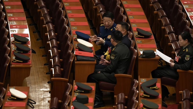 Military delegates chat before the closing session of the National People's Congress in Beijing in March. Chinese state media said on June 13 that a military history buff found a collection of confidential documents related to the country's military in a pile of old papers he bought for under $1. Photo / AP / Ng Han Guan