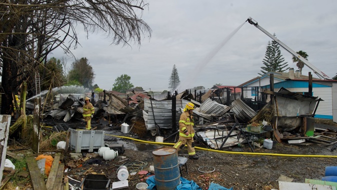 A large fire has engulfed multiple buildings on Coronation Rd in Mangere Bridge, 30 November 2023. Photo / Jason Dorday