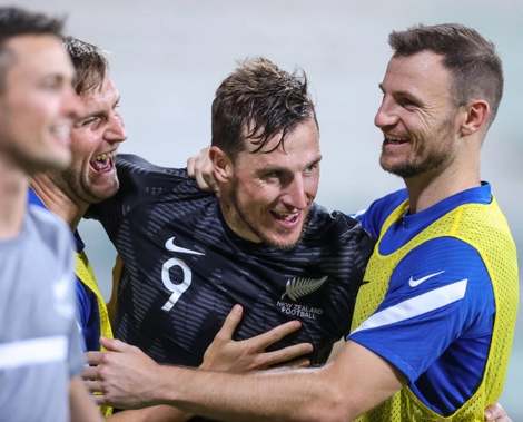 Chris Wood (C) reacts with team mates after scoring his second goal. (Photo / Photosport)