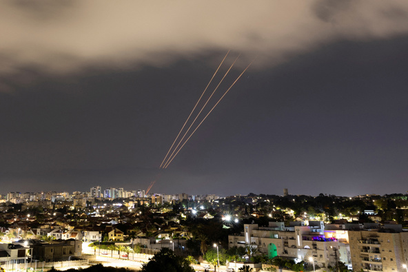 An anti-missile system operates after Iran launched drones and missiles toward Israel, as seen from Ashkelon, Israel, on April 14. Amir Cohen/Reuters