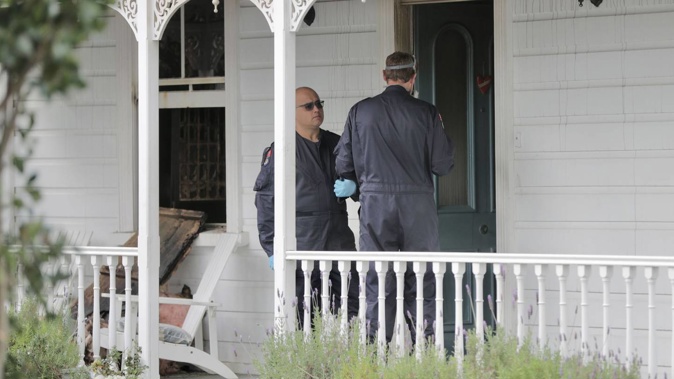 Fire investigators at Aroha Funerals in Auckland after a suspicious fire. Photo / Michael Craig