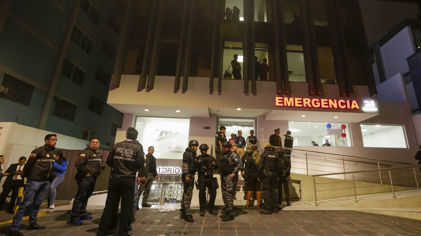 Police guard the hospital where several of the injured were taken after an attack against presidential candidate Fernando Villavicencio. Photo / AP