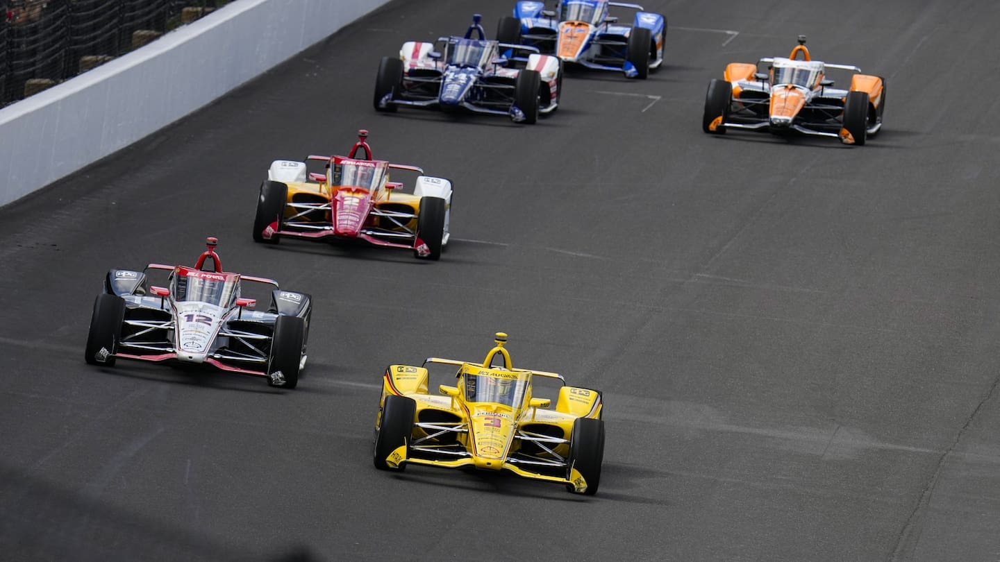 Scott McLaughlin leads the field into the first turn after a restart during the Indianapolis 500 auto race at Indianapolis Motor Speedway. (Photo / AP)