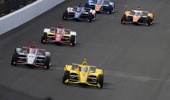 Scott McLaughlin leads the field into the first turn after a restart during the Indianapolis 500 auto race at Indianapolis Motor Speedway. (Photo / AP)