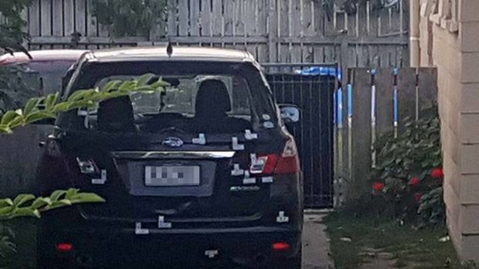 A car left pelted with bullet holes parked at a Haukore St, Tauranga Mongrel Mob home, was allegedly caused by members of the Mongols gang. Photo / Sandra Conchie