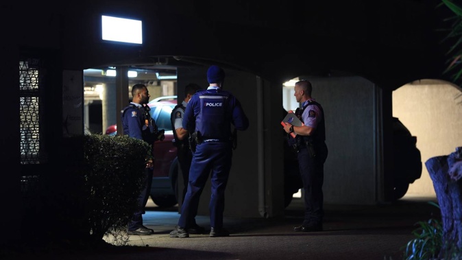 Police on the scene at the Off Broadway Motel in Epsom. Photo / Hayden Woodward