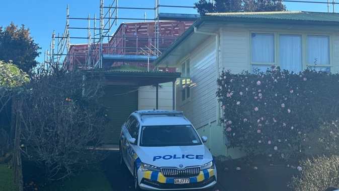 Police on the scene at the home on Dellwood Ave where an elderly woman was assaulted overnight. Photo / Rachel Maher