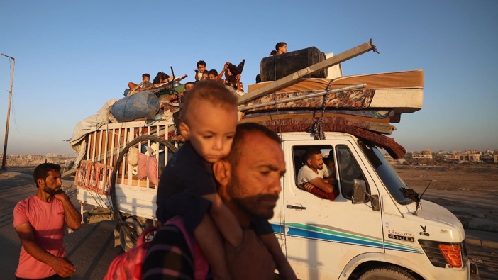 Displaced Palestinians move southwards in the central Gaza Strip on September 20. Photo / Eyad Baba, AFP