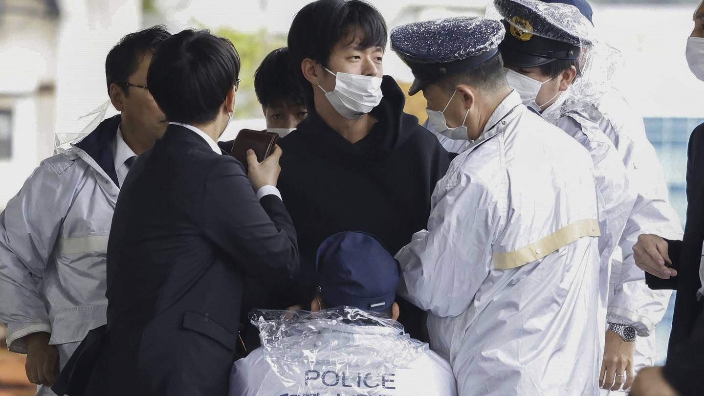 A man who was later identified as Ryuji Kimura is arrested after what appeared to be a pipe bomb was thrown at Japanese Prime Minister Fumio Kishida. Photo / AP