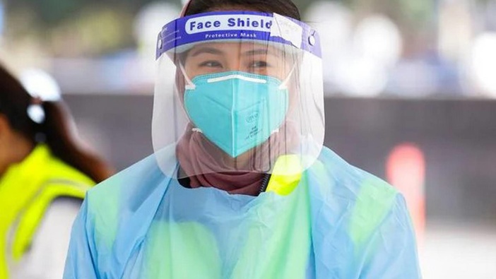 A nurse is seen on duty at the Bondi Beach Covid-19 testing clinic. (Photo / NCA)