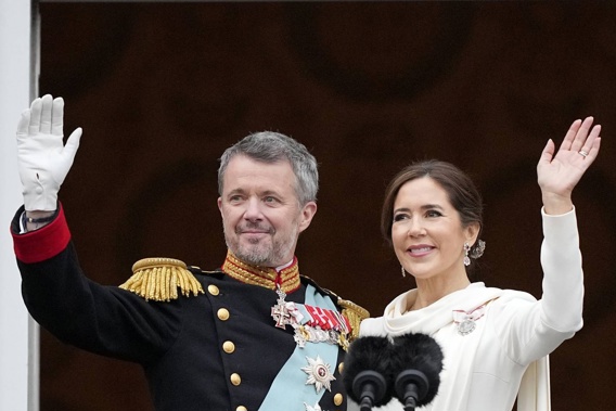 Denmark's King Frederik X and Queen Mary wave from the balcony of Christiansborg Palace in Copenhagen. Photo / AP