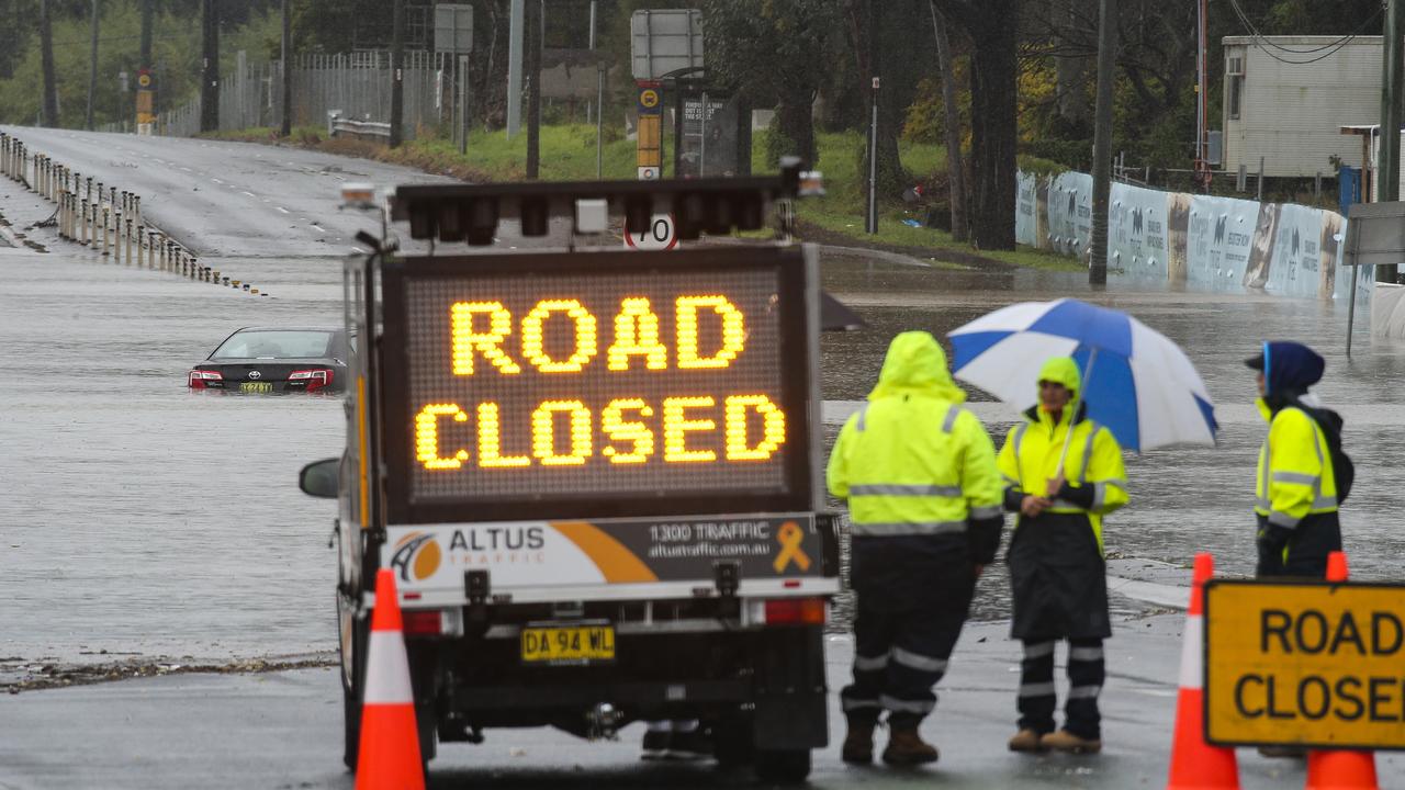 Road closed in Chipping Norton, Sydney, as the Georges River rapidly rises. (Photo / news.com.au)