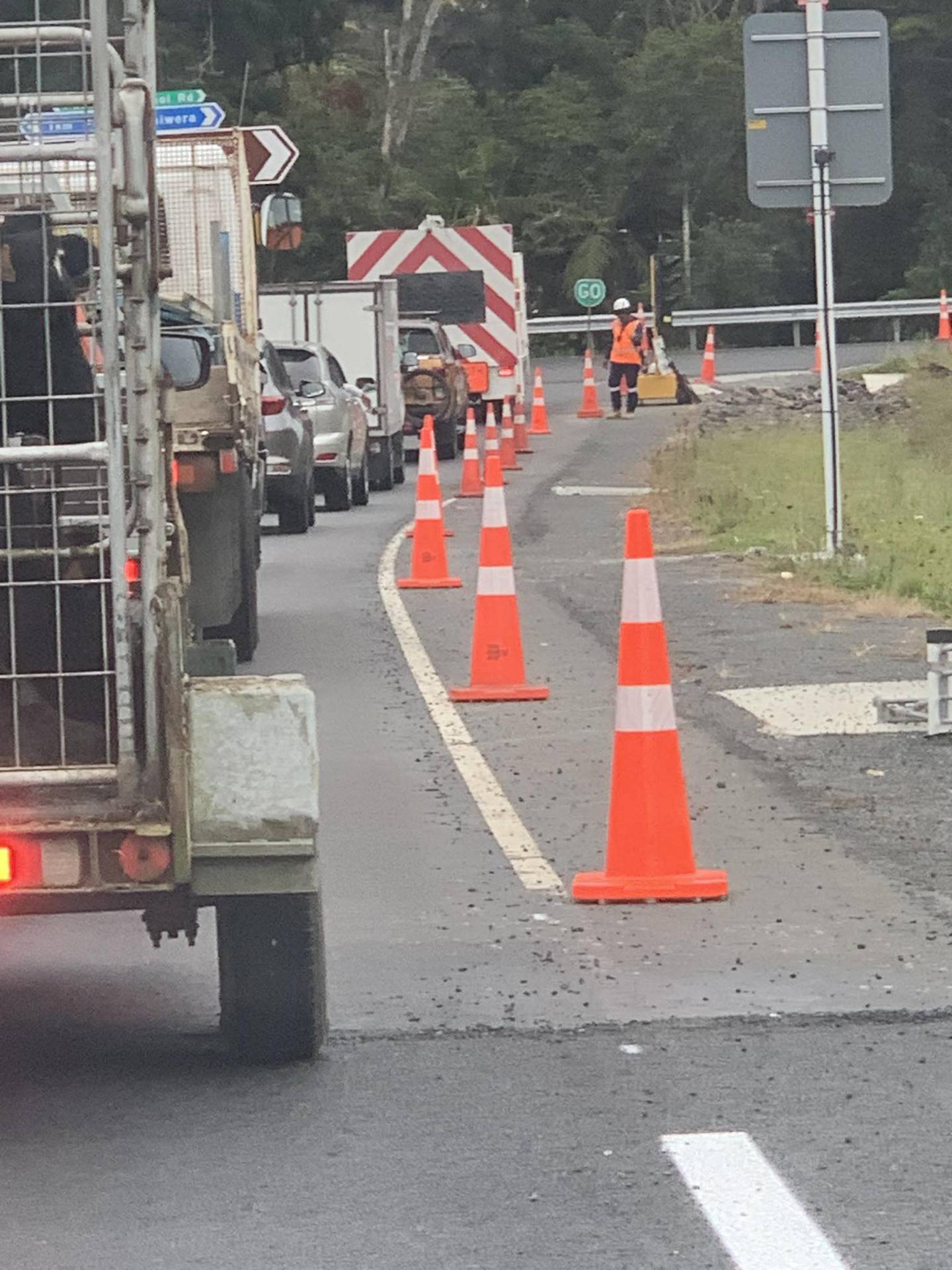 Holiday traffic on State Highway 1 north of Johnstones Hill Tunnels under the control of a stop-go roadworker. Photo / Supplied