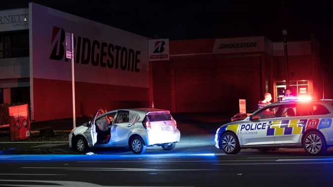 Police at the scene after teens fleeing police crashed into another vehicle in Greenlane, Auckland early this morning. Photo / Hayden Woodward